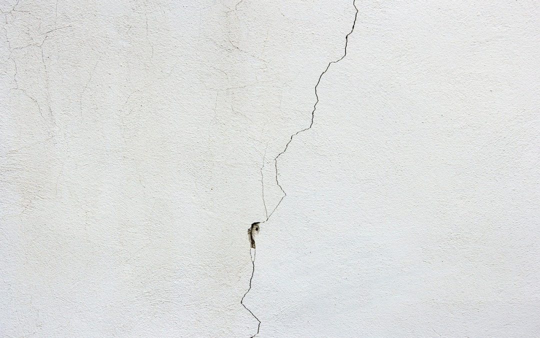 signs of structural issues include cracked walls like the one seen here